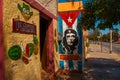 Grunge graffiti portrait of Che Guevara and Cuba flag on the wall. Varadero. Cuba