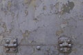 Grunge gray metal iron texture background with loops and bolts. Royalty Free Stock Photo