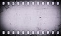 Grunge gray scratched dirty film strip background.