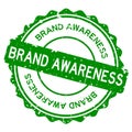 Grunge green brand awareness word round rubber stamp on white background