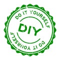 Grunge green DIY word Abbreviation of Do it yourself word round rubber stamp on white background