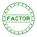 Grunge green factor word round rubber stamp on white background