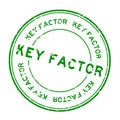 Grunge green key factor word round rubber stamp on white background