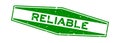 Grunge green reliable word hexagon rubber seal stamp on white background