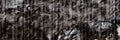 Grunge grey stone wall texture of cracked concrete rock or asphalt panoramic banner. Cement stone Royalty Free Stock Photo