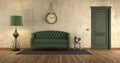 Grunge interior with green sofa and door Royalty Free Stock Photo