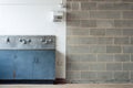 Grunge interior with wall and washing trough