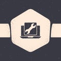 Grunge Laptop with wrench icon isolated on grey background. Adjusting, service, setting, maintenance, repair, fixing