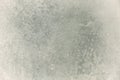 Grunge light gray surface with dirt and dust and scratches on it, gray brush strokes texture background