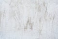 Grunge light gray texture of an old wall with black divorces, white surface with smudges, abstract background Royalty Free Stock Photo