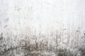 Grunge light gray texture of an old wall with black divorces, white surface with smudges, abstract background Royalty Free Stock Photo