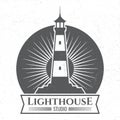 Grunge lighthous silhouette logo or label