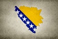 Map of Bosnia and Herzegovina with its flag printed on a paper Royalty Free Stock Photo