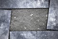 Grunge metal background. metal plate on black grille. Royalty Free Stock Photo