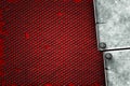 Grunge metal background. metal plate on black grille and red pla Royalty Free Stock Photo