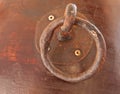 Grunge metal doorknocker on wood