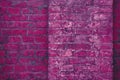 Grunge neon pink brick wall texture background.