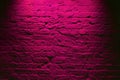 Grunge neon pink brick wall texture background. Magenta colored brick wall texture architecture pattern