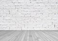 Grunge old aged brick wall painted in white color with wooden floor textured background in light grey Royalty Free Stock Photo
