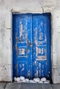 Grunge old blue door in Oia town, Santorini, Greece Royalty Free Stock Photo