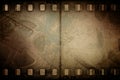 Grunge old motion picture reel with film strip Royalty Free Stock Photo