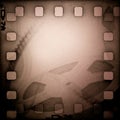 Grunge old motion picture reel with film strip Royalty Free Stock Photo