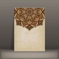 Grunge paper card with brown floral circular