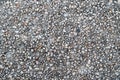 Grunge pebble floor as seamless textured background.Small pebbles mixed with sand texted background Royalty Free Stock Photo