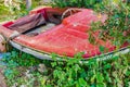 Vintage boat, ancient red motorboat at shore