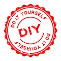 Grunge red DIY Abbreviation of Do it yourself word round rubber seal stamp on white background
