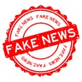 Grunge red fake news word round rubber stamp on white background Royalty Free Stock Photo