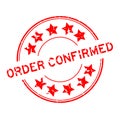 Grunge red confirmed word with star icon round rubber seal stamp on white background Royalty Free Stock Photo