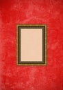 Grunge red stucco wall with empty picture frame Royalty Free Stock Photo