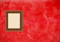 Grunge red stucco wall with empty picture frame Royalty Free Stock Photo
