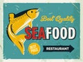 Grunge retro metal sign with seafood logo. Vintage poster. Old fish restaurant. Food and drink background theme. Royalty Free Stock Photo