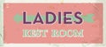 Grunge retro restroom metal sign. Ladies old board. Vintage poster with arrow. Old fashioned design.