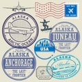 Grunge rubber stamp and signs set with the name and map of Alaska Royalty Free Stock Photo