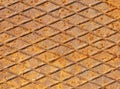 Grunge rusted drain cover background with diamond pattern. Oxidized iron panel. Texture or backdrop. Rusty manhole cap, corrosion Royalty Free Stock Photo