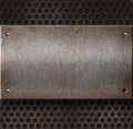 Grunge rusty metal plate over grid Royalty Free Stock Photo