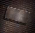 Grunge rusty metal plate over grid background Royalty Free Stock Photo