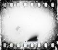 Grunge scratched dirty film strip background with blurred effect. Royalty Free Stock Photo