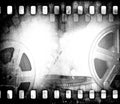 Grunge scratched dirty film strip background with reel.