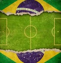 Grunge soccer or football field and flag of Brazil background