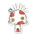 grunge sticker of tattoo style toadstool house Royalty Free Stock Photo