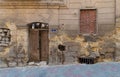 Grunge stone bricks wall with Broken wooden door and closed broken window, Cairo, Egypt Royalty Free Stock Photo