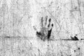 Grunge textured black and white cement plaster wall surface with a handprint Royalty Free Stock Photo