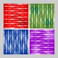 Grunge tile set in different colors - red, green, blue, purple. White brush strokes on stained background. Modern seamless vector