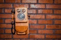 Grunge urban background of a brick wall with an old out of service payphone Royalty Free Stock Photo