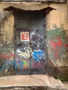 Grunge urban scene with door and graffiti Royalty Free Stock Photo