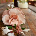 Grunge wood texture with empty space decorating by white flowers mixed with a fabric pink flower. Romantic concept.